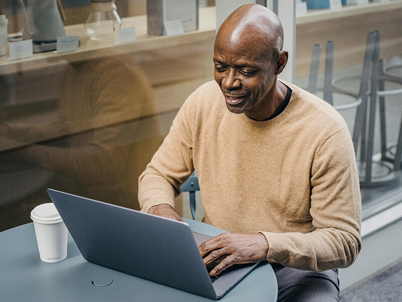 An image of James using MeetApp on his computer.